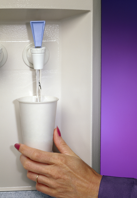 Genesis Coworking Space — water dispenser filling a cup